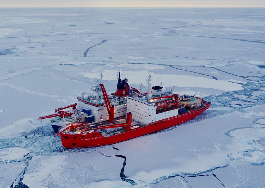 Two research vessels side by side in the Arctic Ocean sea ice